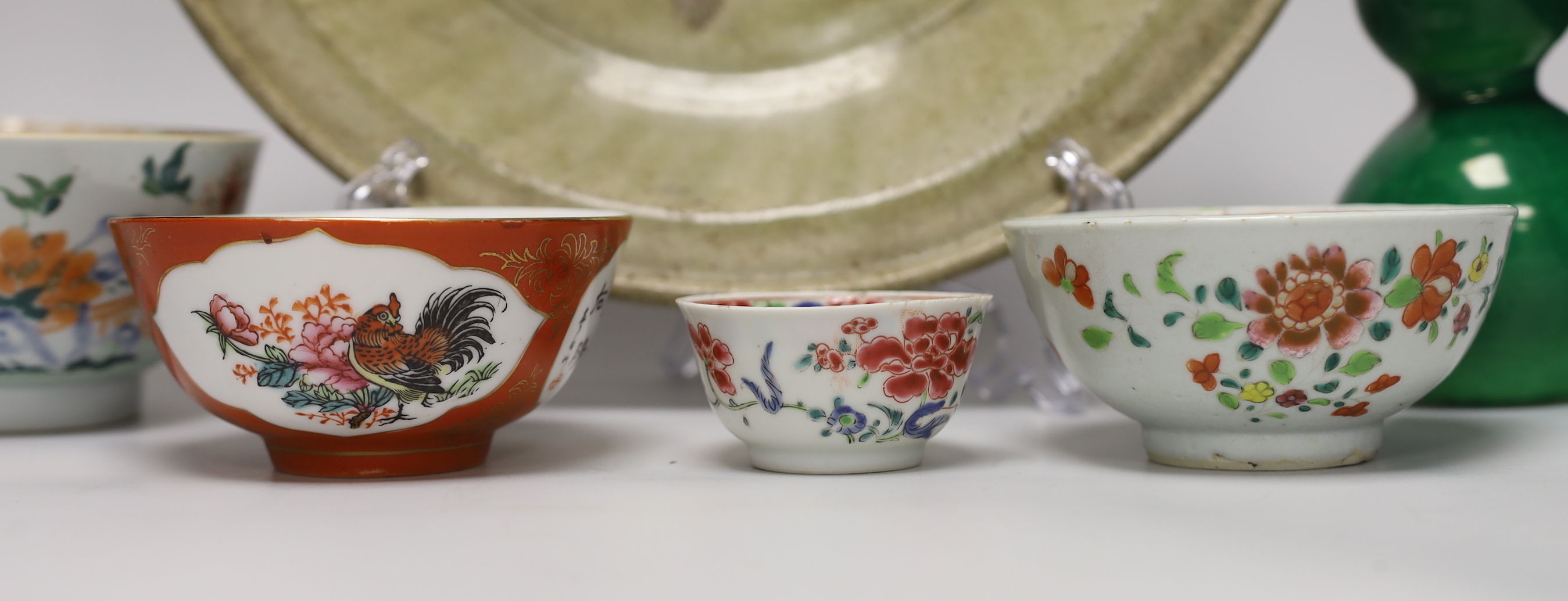 A Thai Sawankhalok celadon dish, 35cm, four rice and tea bowls and a double gourd vase